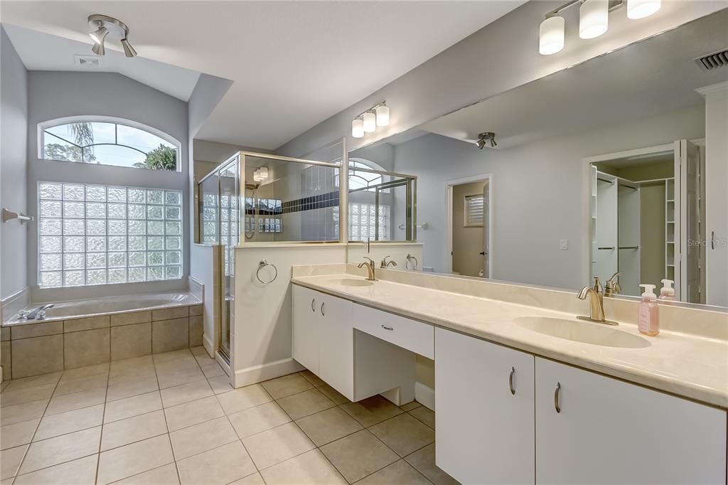16 Edgar Lane Palm Coast, FL 32164 - Photo 20 of 53 a spacious bathroom with a sink mirror and a bath tub