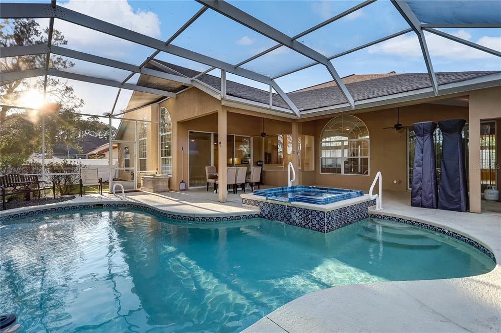 16 Edgar Lane Palm Coast, FL 32164 - Photo 2 of 53 a view of a swimming pool with outdoor seating