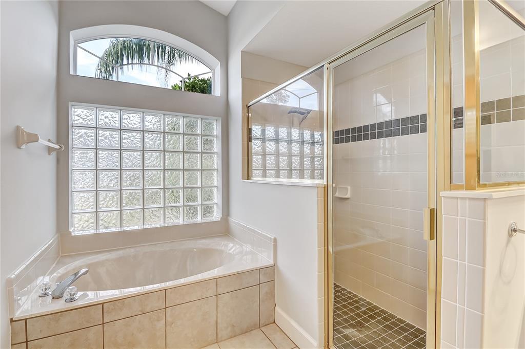 16 Edgar Lane Palm Coast, FL 32164 - Photo 22 of 53 a bathroom with a tub and shower