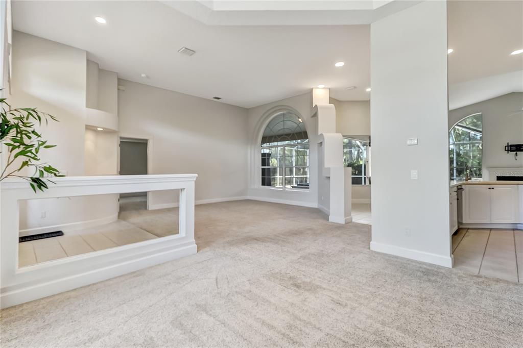 16 Edgar Lane Palm Coast, FL 32164 - Photo 25 of 53 a view of an empty room with a fireplace and a potted plant