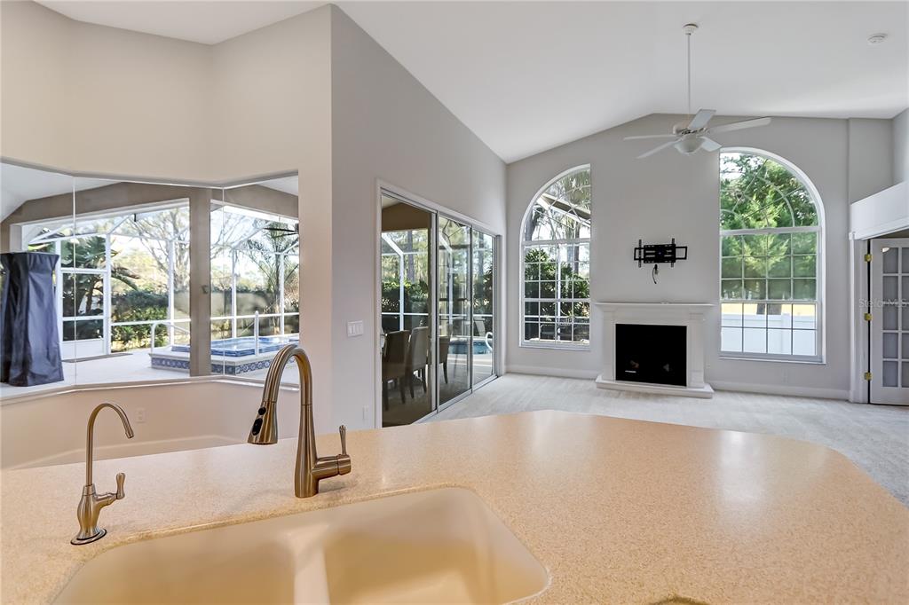 16 Edgar Lane Palm Coast, FL 32164 - Photo 31 of 53 a kitchen with furniture and a fireplace