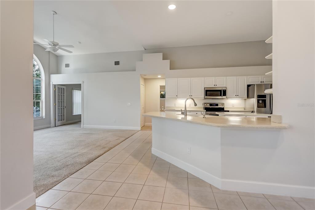 16 Edgar Lane Palm Coast, FL 32164 - Photo 37 of 53 a kitchen with stainless steel appliances a refrigerator sink and microwave