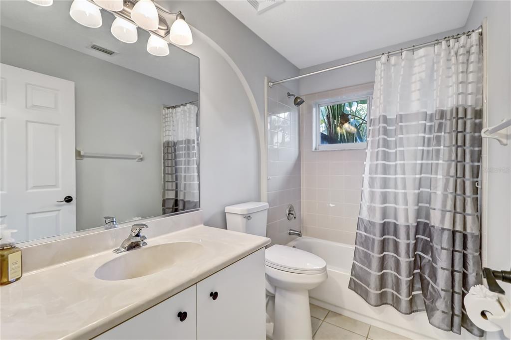 16 Edgar Lane Palm Coast, FL 32164 - Photo 41 of 53 a bathroom with a sink a toilet a mirror a vanity and shower