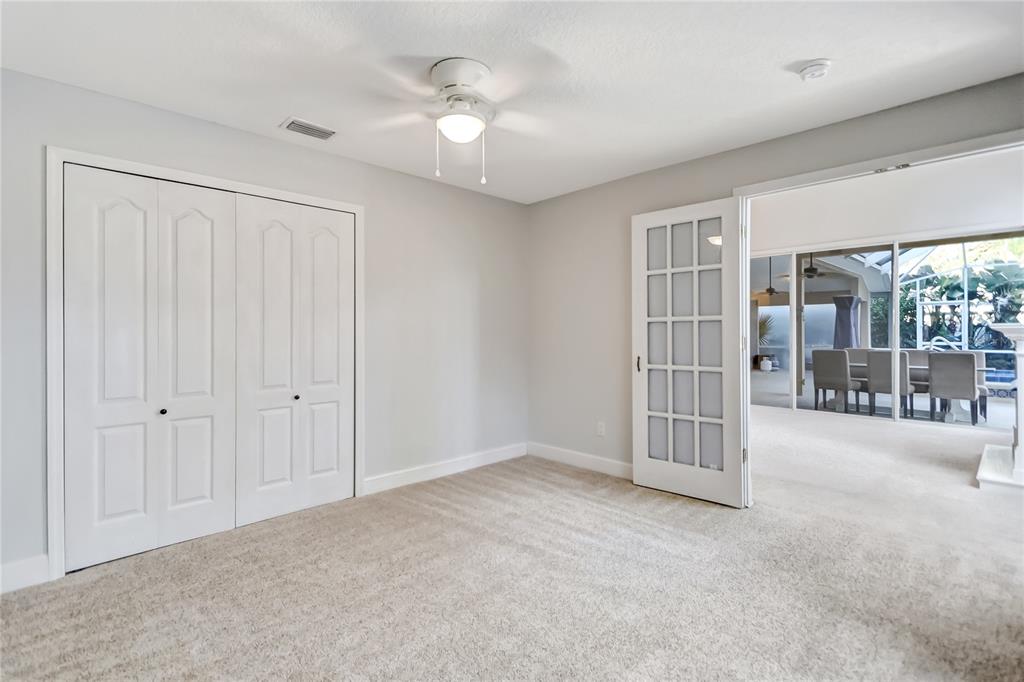 16 Edgar Lane Palm Coast, FL 32164 - Photo 45 of 53 en empty room with windows and fan