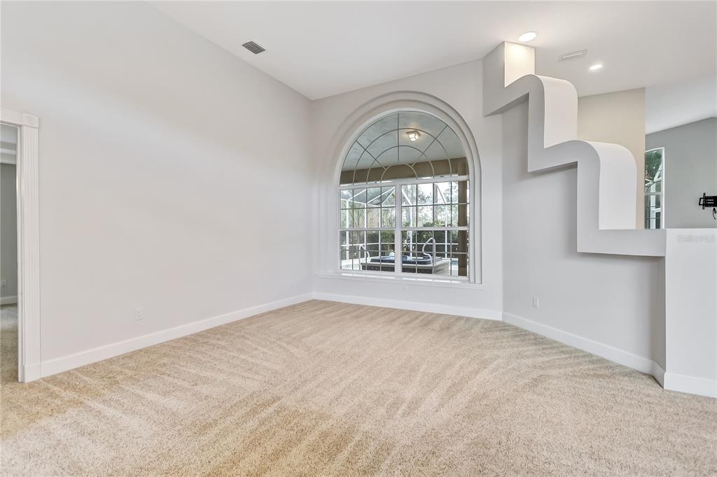 16 Edgar Lane Palm Coast, FL 32164 - Photo 10 of 53 an empty room with windows