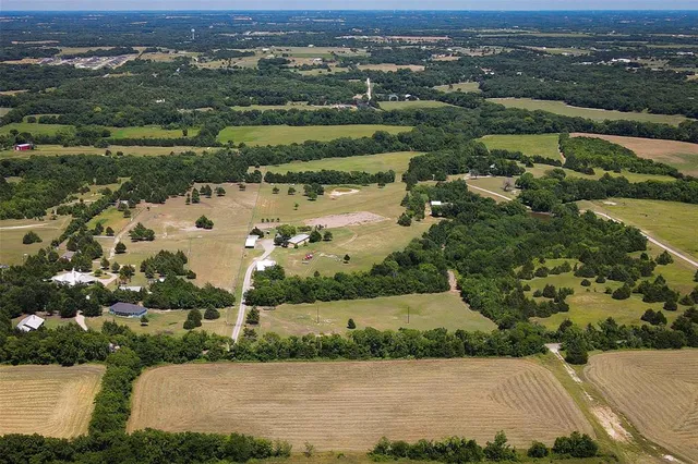 an aerial view of a city with lake view