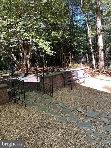 a view of a yard with sitting area