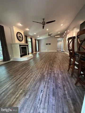 a view of a room with wooden floor