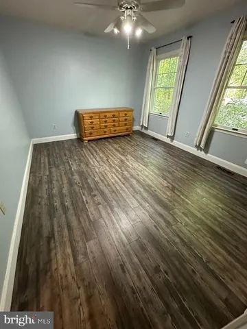 a bathroom with a sink mirror vanity and toilet