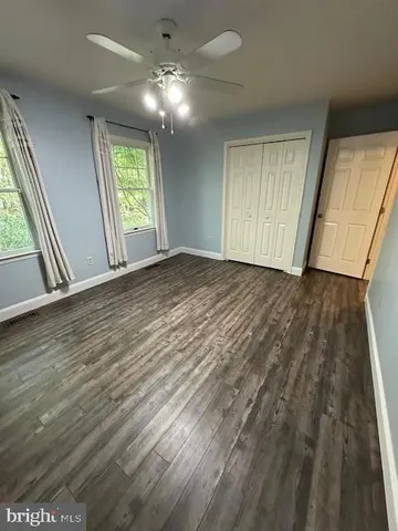 wooden floor in an empty room with glass door