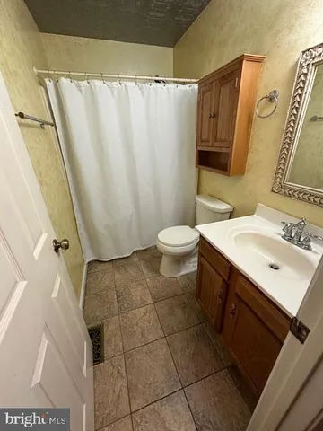 wooden floor in a hall with an entryway