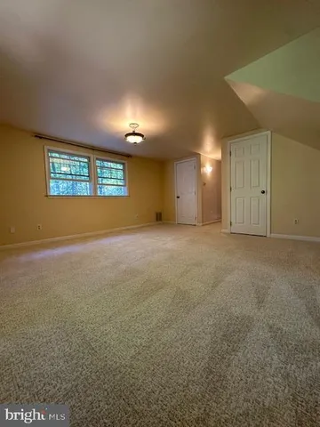 a view of a big room with a fireplace