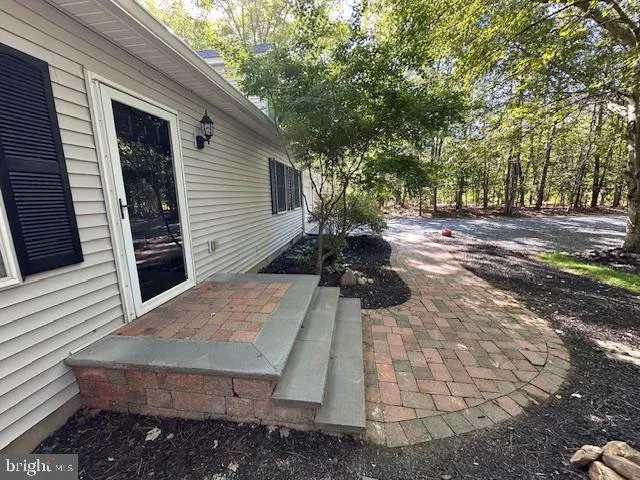 a view of a backyard with sitting area