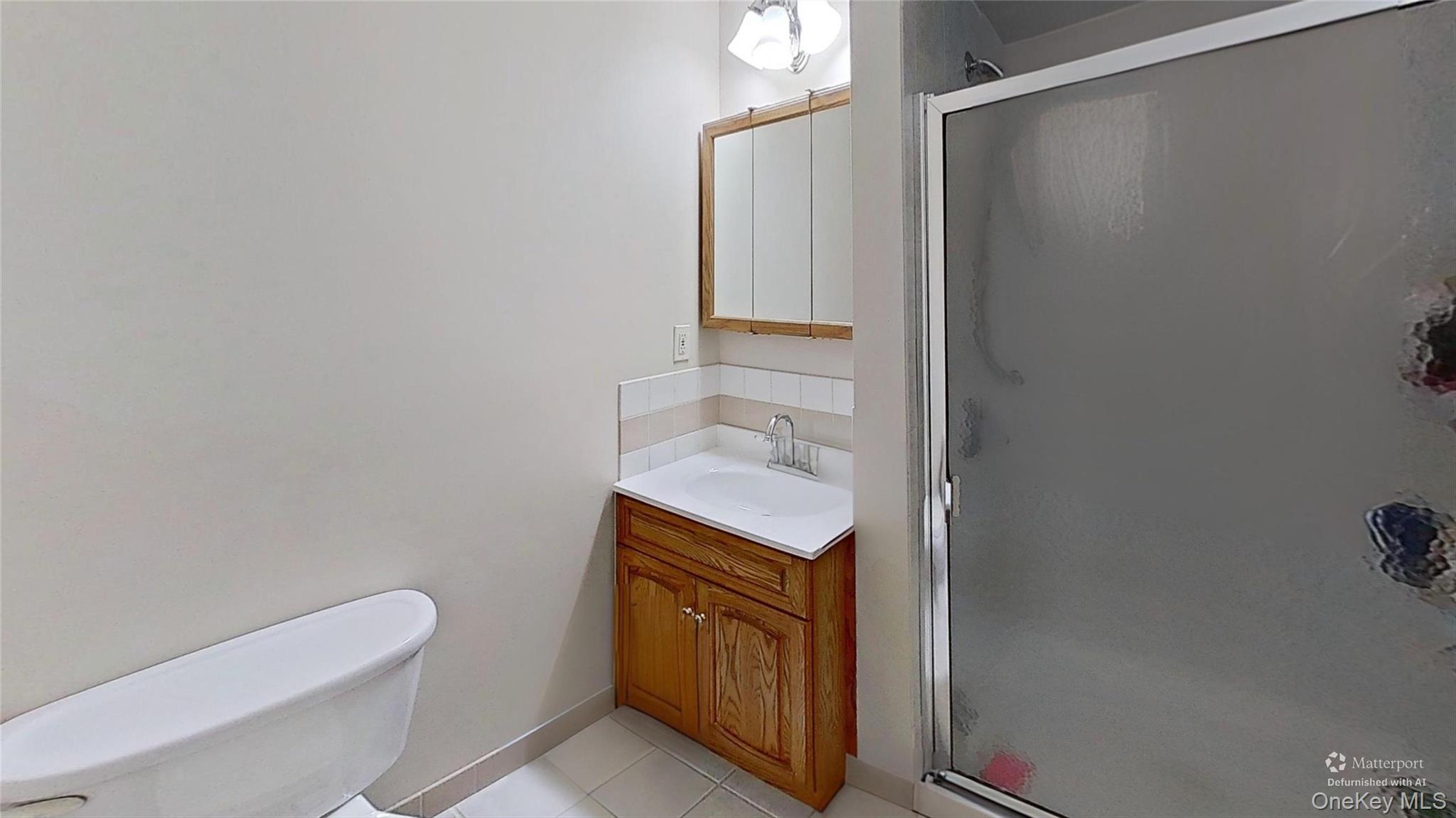 347 Miller Place Road Miller Place, NY 11764 - Photo 14 of 29 Having a FULL BATHROOM off the primary bedroom is a great benefit with this home!