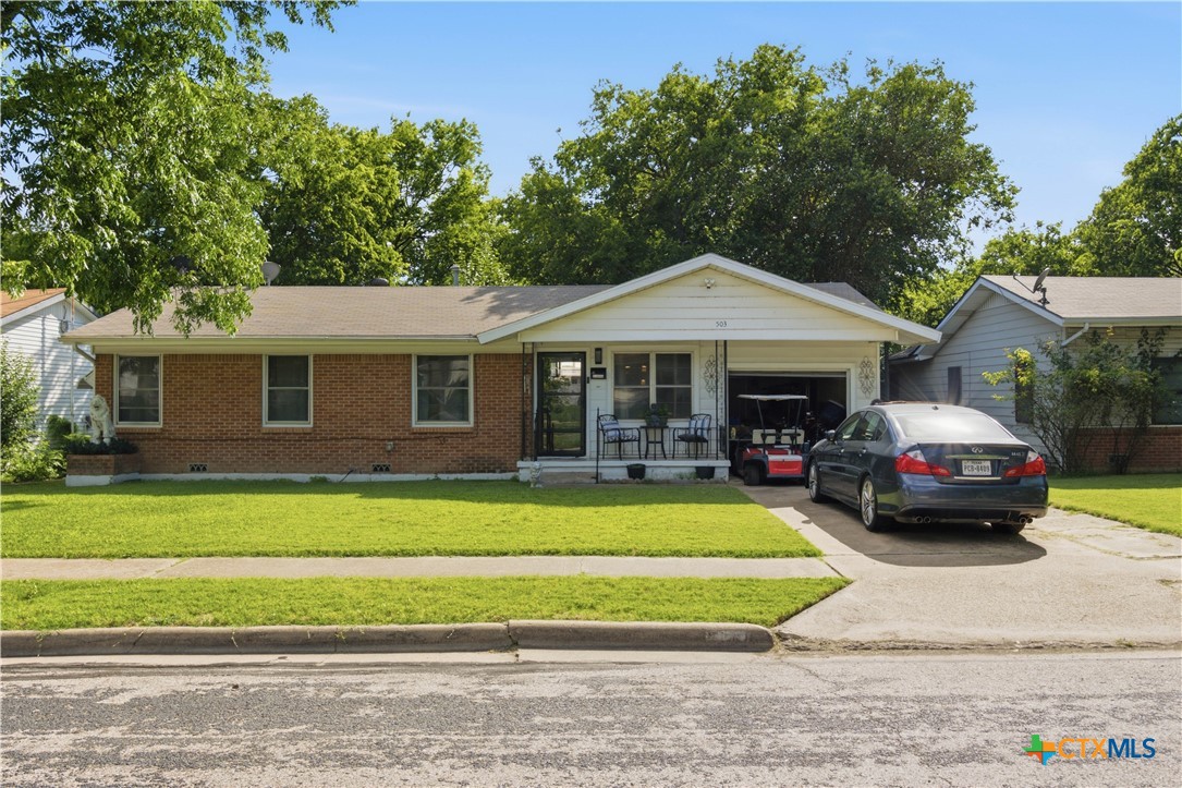 503 Cardinal Avenue Killeen, TX 76541 - Photo 1 of 26 a front view of a house with a garden and porch