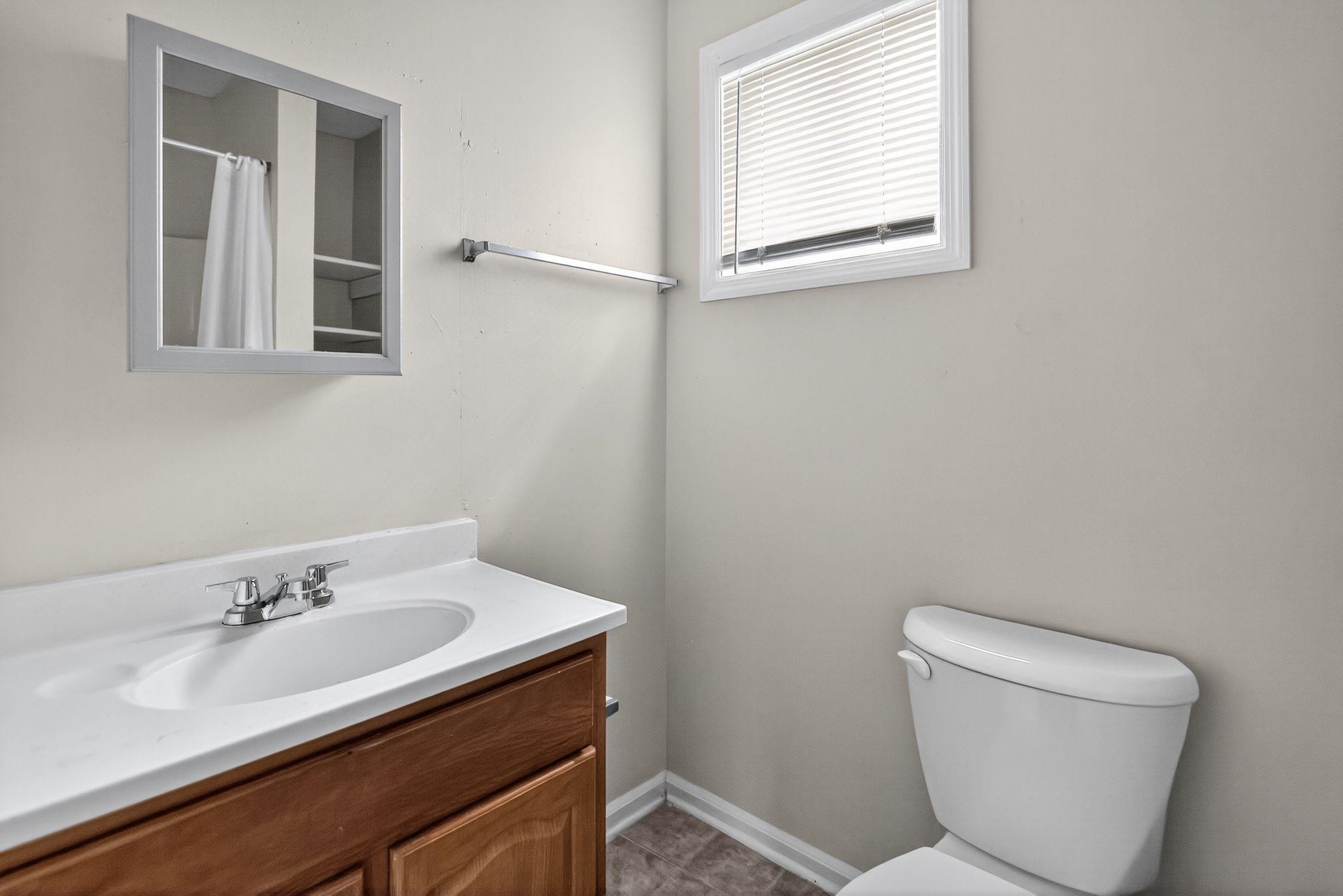 1563 Flamingo Road Memphis, TN 38117 - Photo 12 of 33 Bathroom featuring toilet and vanity