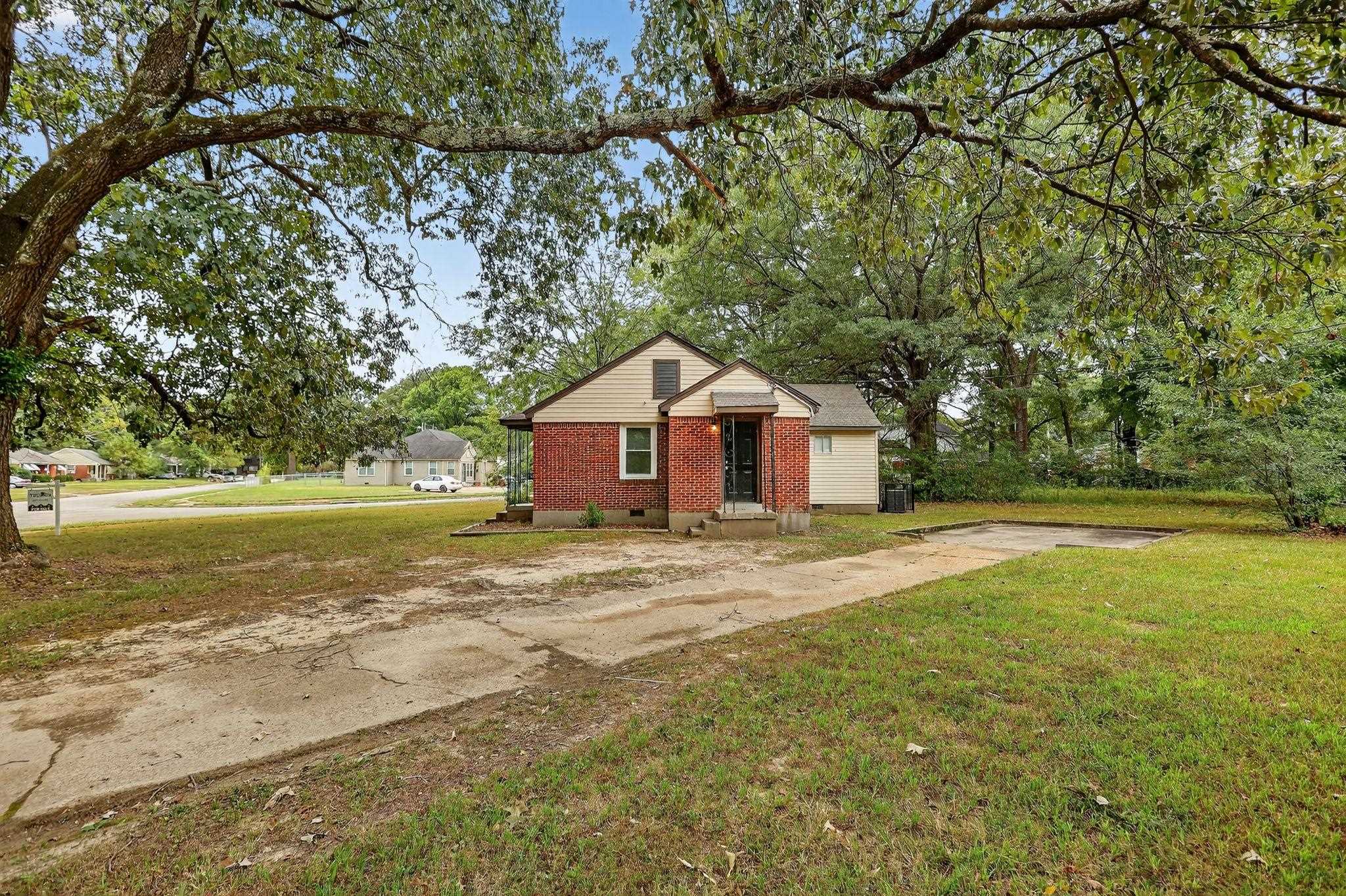 1563 Flamingo Road Memphis, TN 38117 - Photo 27 of 33 Bungalow-style house featuring a front yard, concrete driveway, brick siding, and crawl space