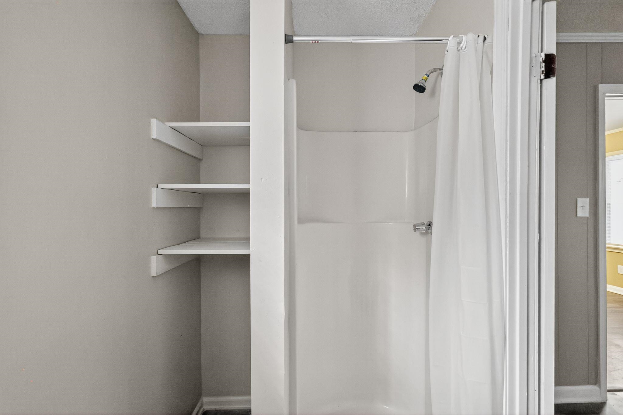 1563 Flamingo Road Memphis, TN 38117 - Photo 9 of 33 Full bathroom featuring a stall shower and a textured ceiling