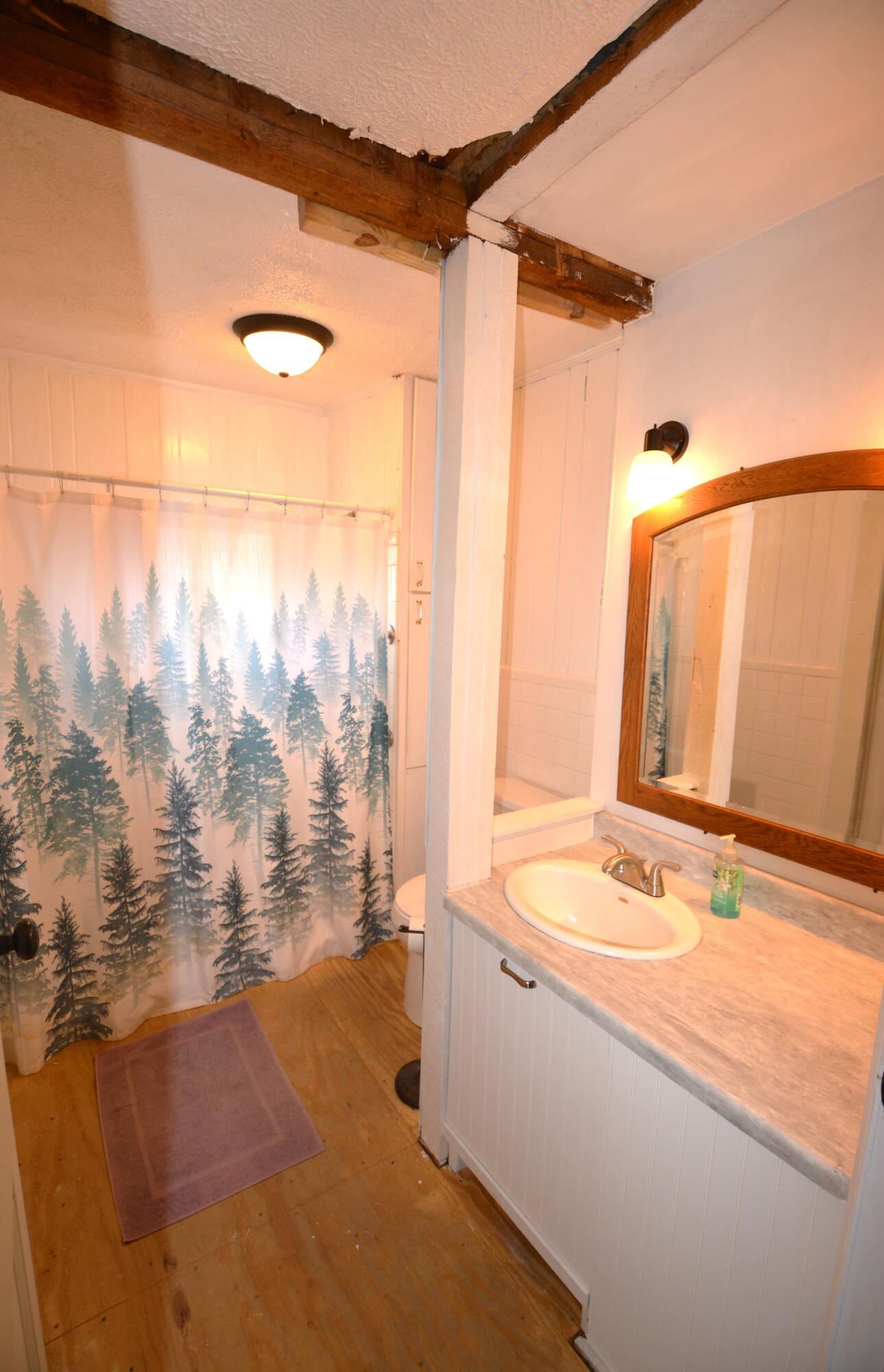 3316 Bassett Heights Road Bassett, VA 24055 - Photo 20 of 51 a bathroom with a granite countertop sink a mirror and shower