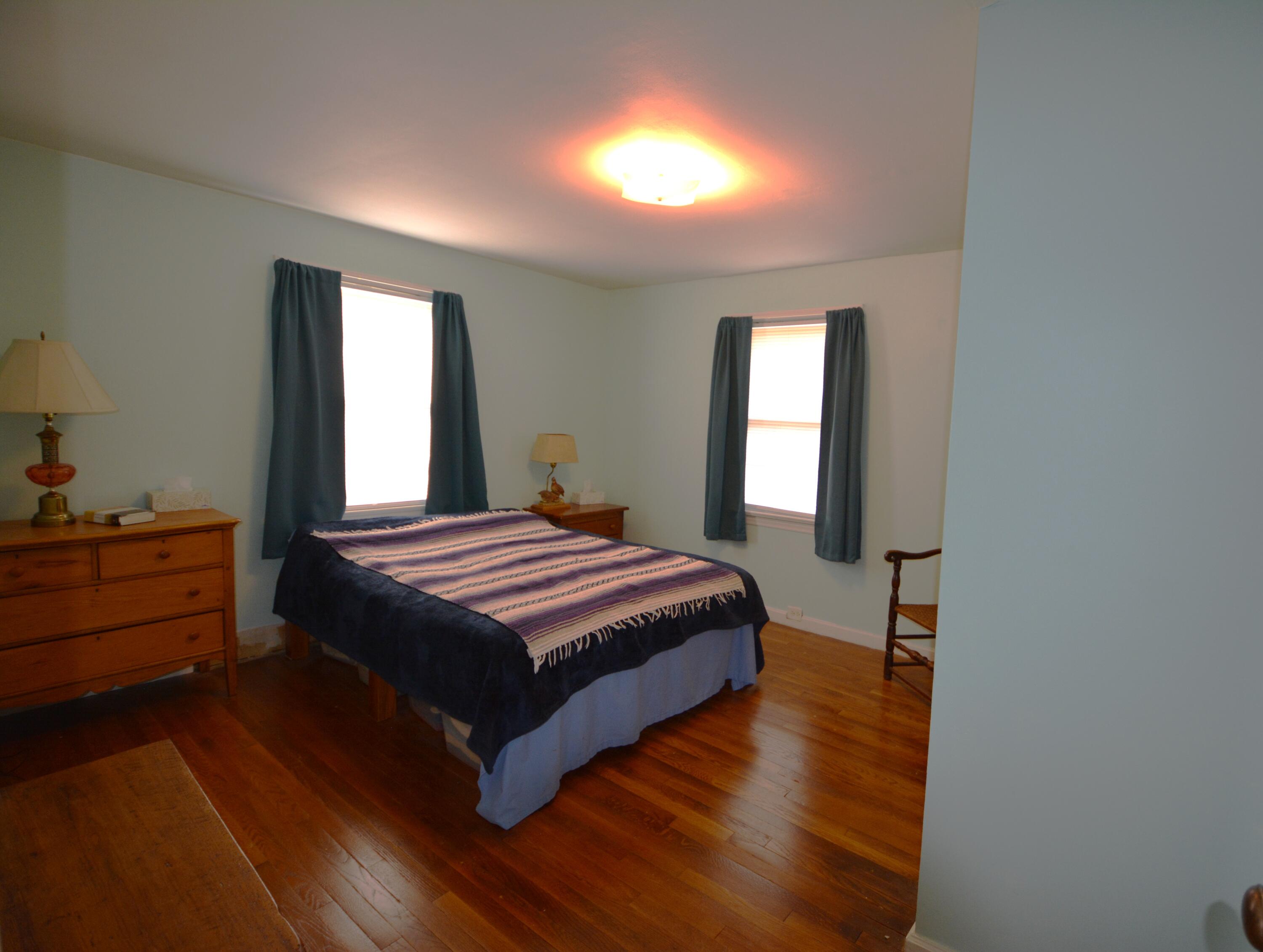 3316 Bassett Heights Road Bassett, VA 24055 - Photo 21 of 51 a spacious bedroom with a bed and a window