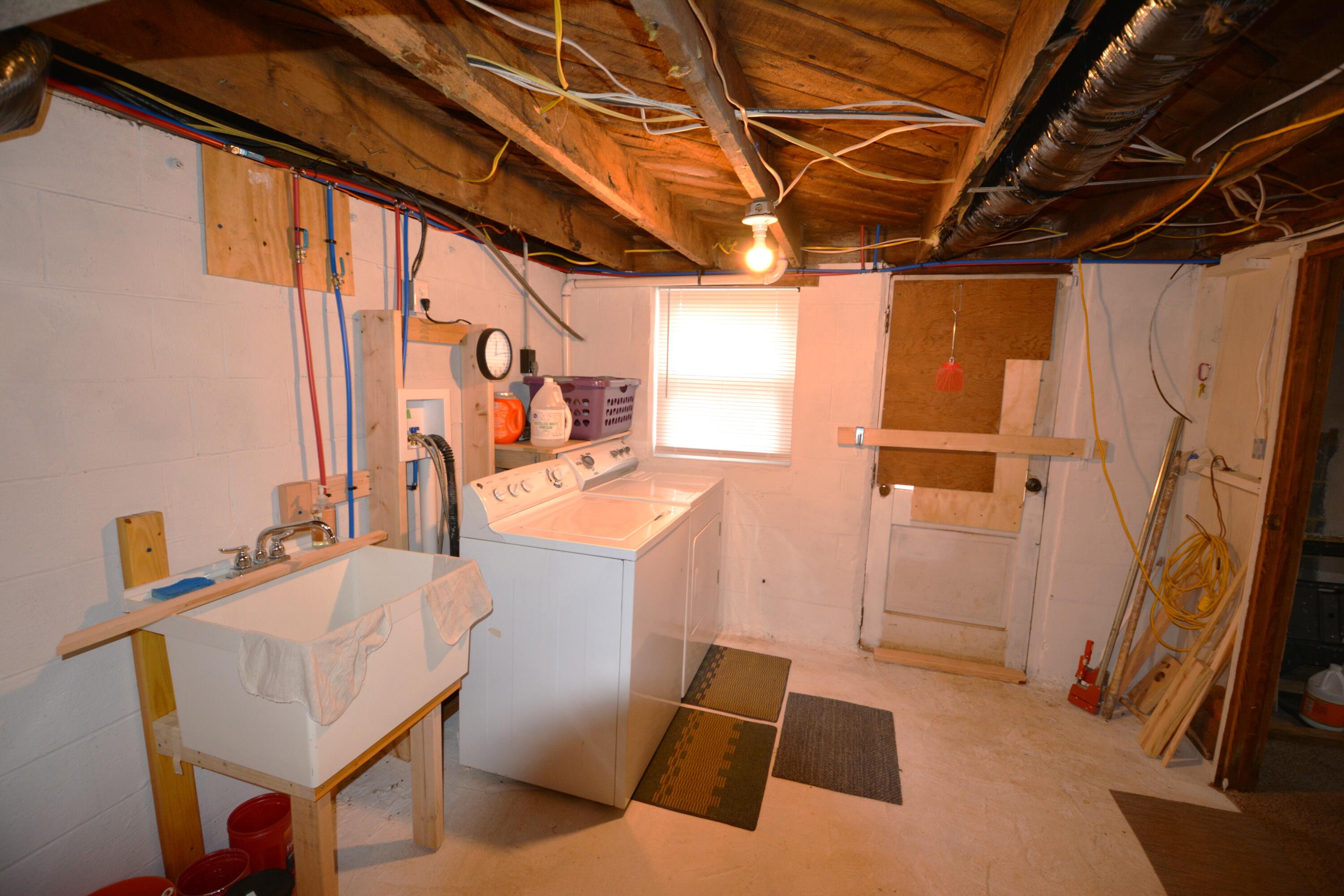 3316 Bassett Heights Road Bassett, VA 24055 - Photo 33 of 51 a utility room with sink dryer and washer
