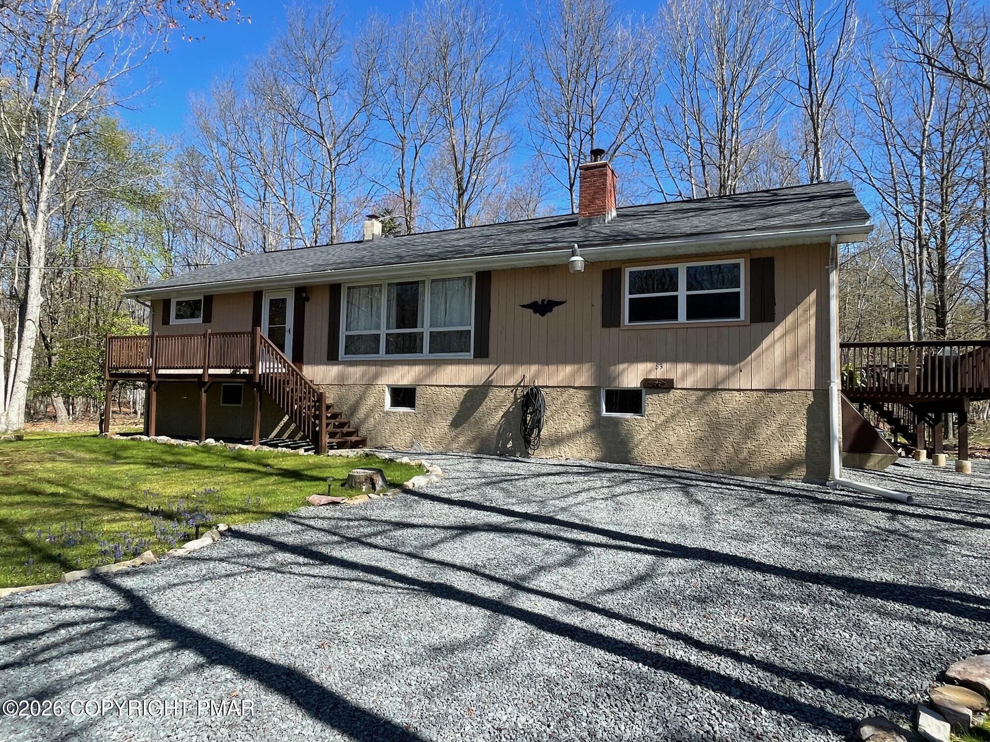 83 Fox Hill Road Albrightsville, PA 18210 - Photo 1 of 22 a front view of a house with garden