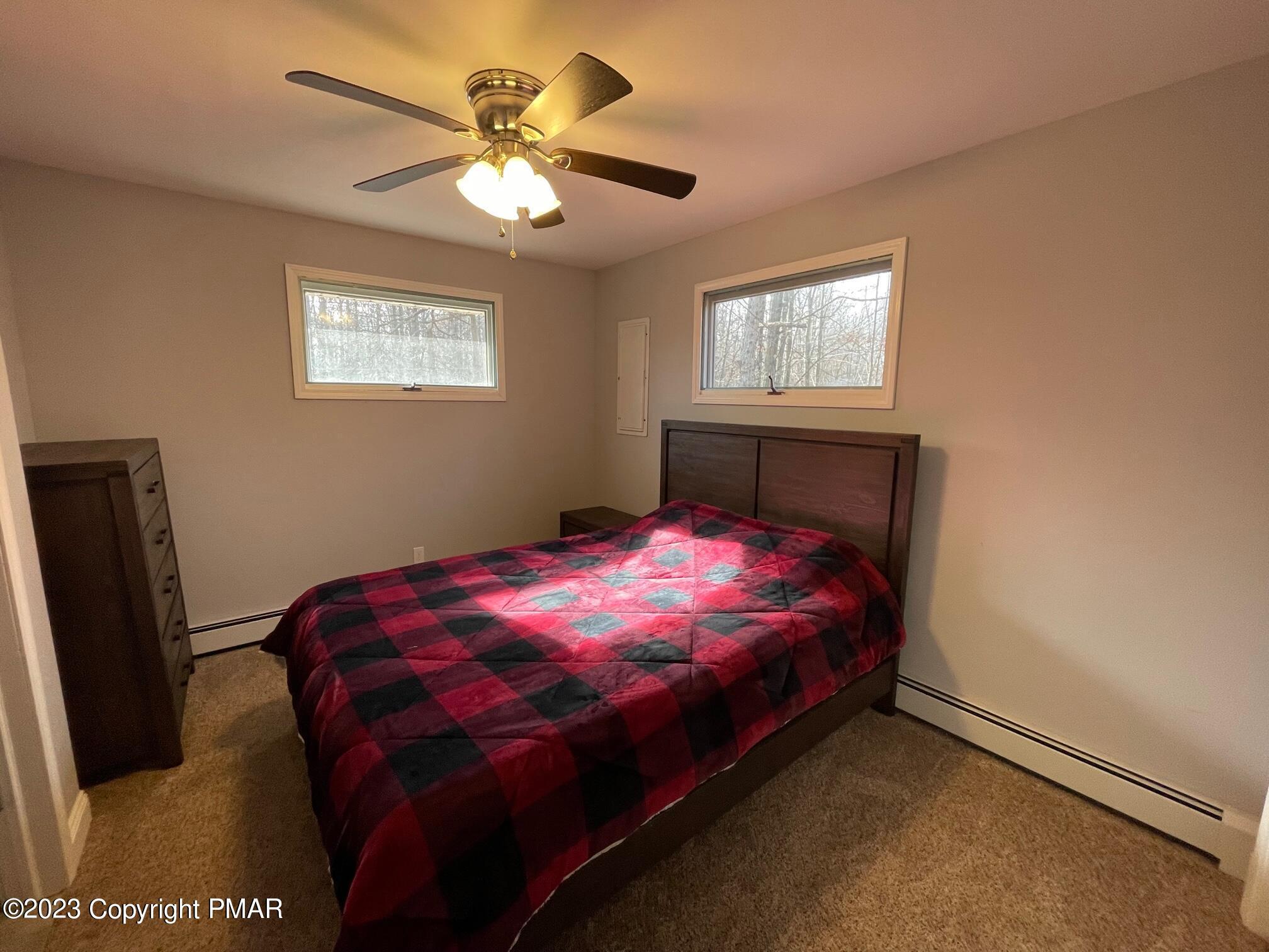 83 Fox Hill Road Albrightsville, PA 18210 - Photo 15 of 22 a bed sitting in a bedroom next to a window