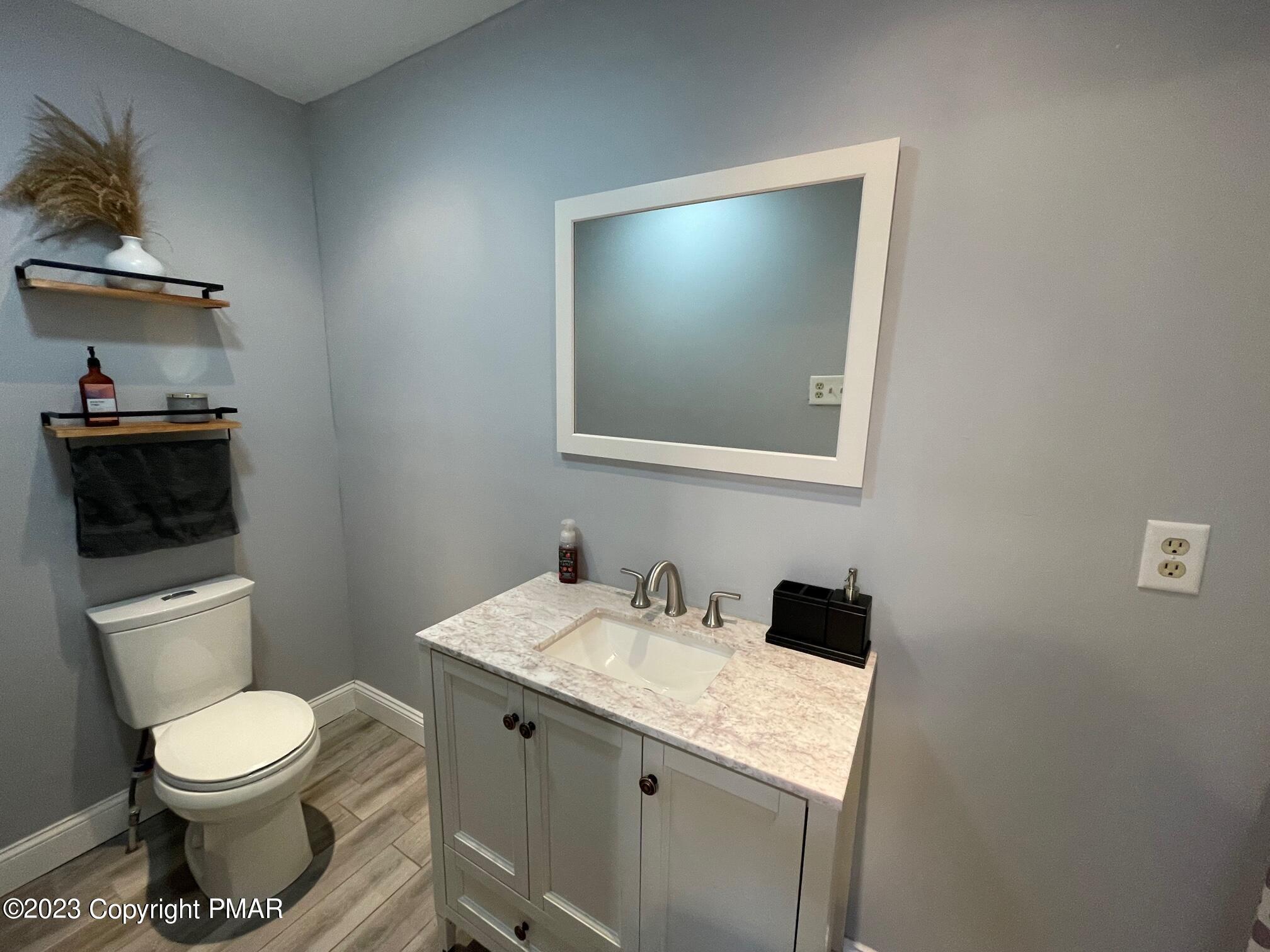 83 Fox Hill Road Albrightsville, PA 18210 - Photo 17 of 22 a bathroom with a toilet sink and mirror