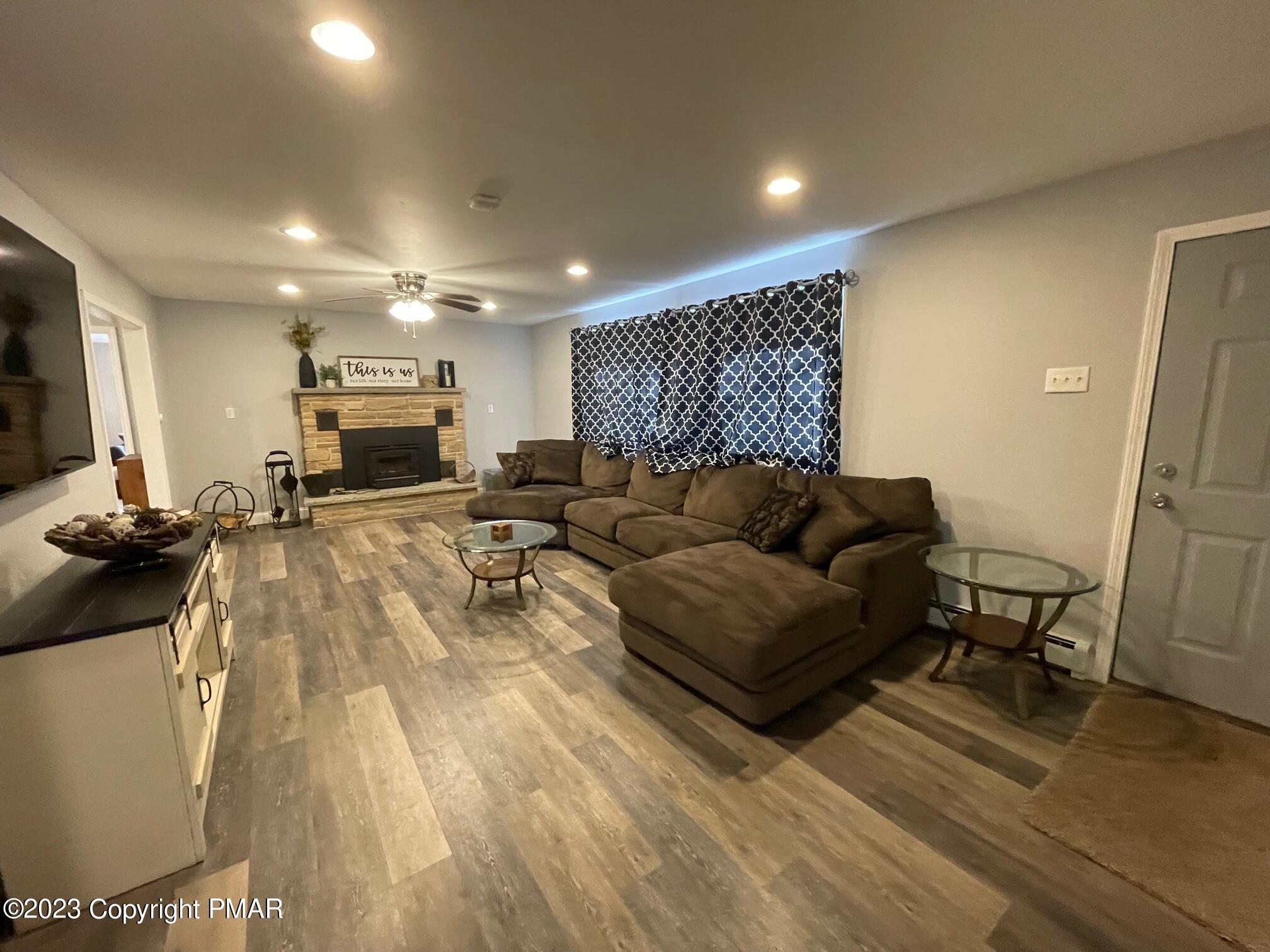 83 Fox Hill Road Albrightsville, PA 18210 - Photo 2 of 22 a living room with furniture and a wooden floor