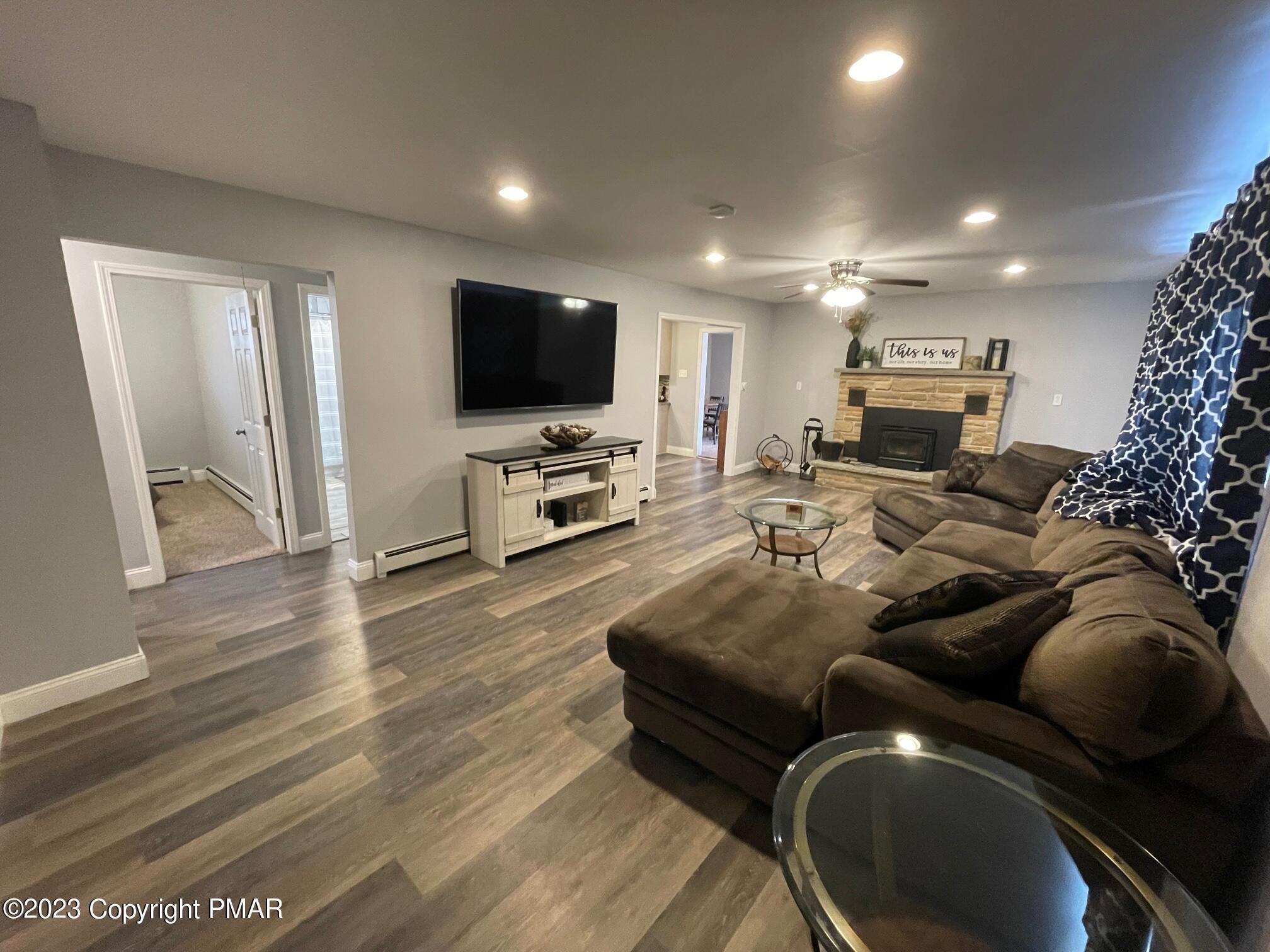 83 Fox Hill Road Albrightsville, PA 18210 - Photo 3 of 22 a living room with furniture and a flat screen tv