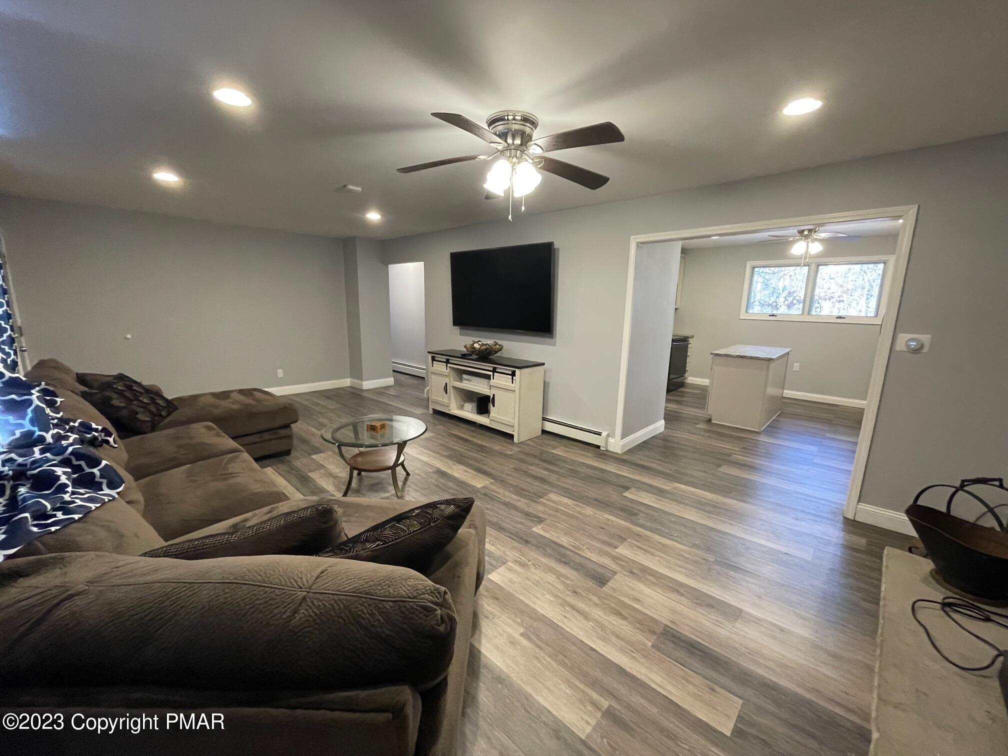 83 Fox Hill Road Albrightsville, PA 18210 - Photo 5 of 22 a living room with furniture and a flat screen tv