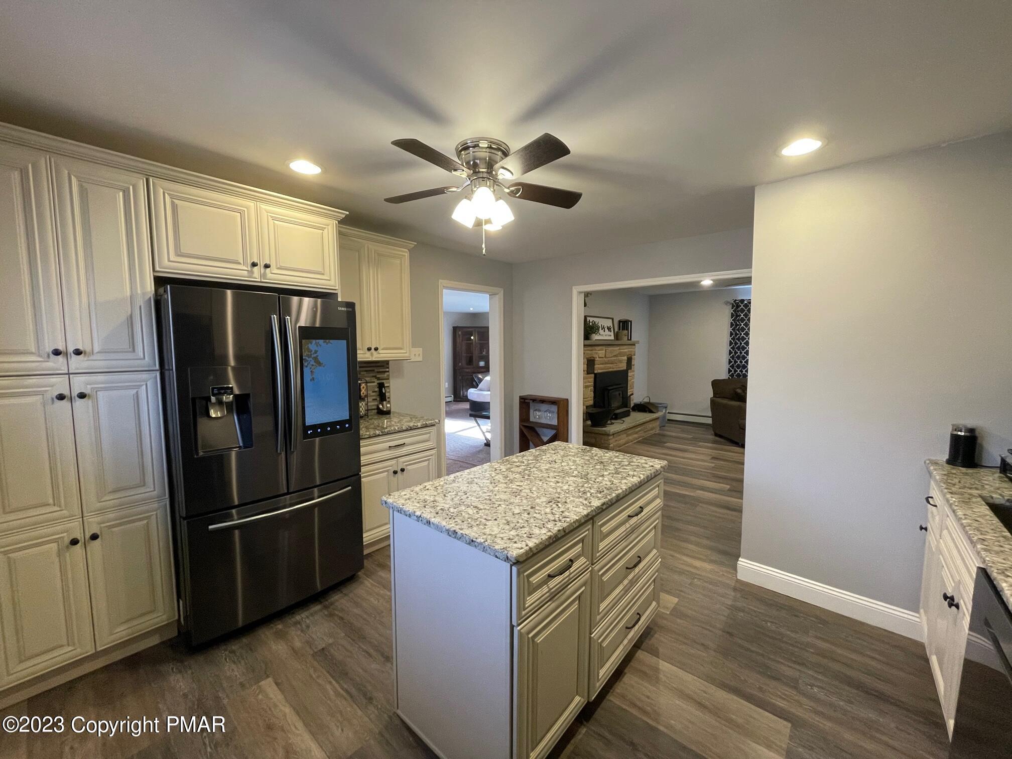 83 Fox Hill Road Albrightsville, PA 18210 - Photo 9 of 22 a kitchen with stainless steel appliances granite countertop a refrigerator and a sink