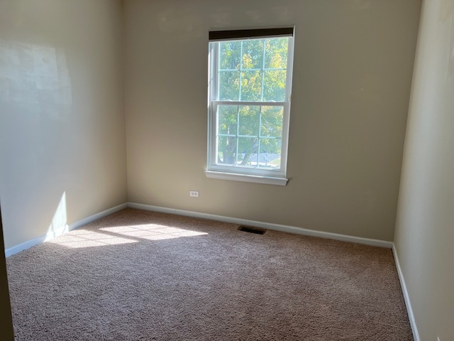 1229 Pennsbury Lane Aurora, IL 60502 - Photo 19 of 25 an empty room with a window