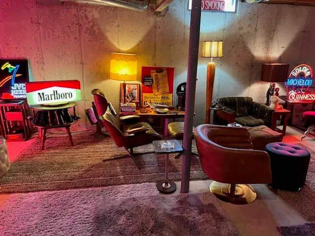 a living room with furniture and a lamp