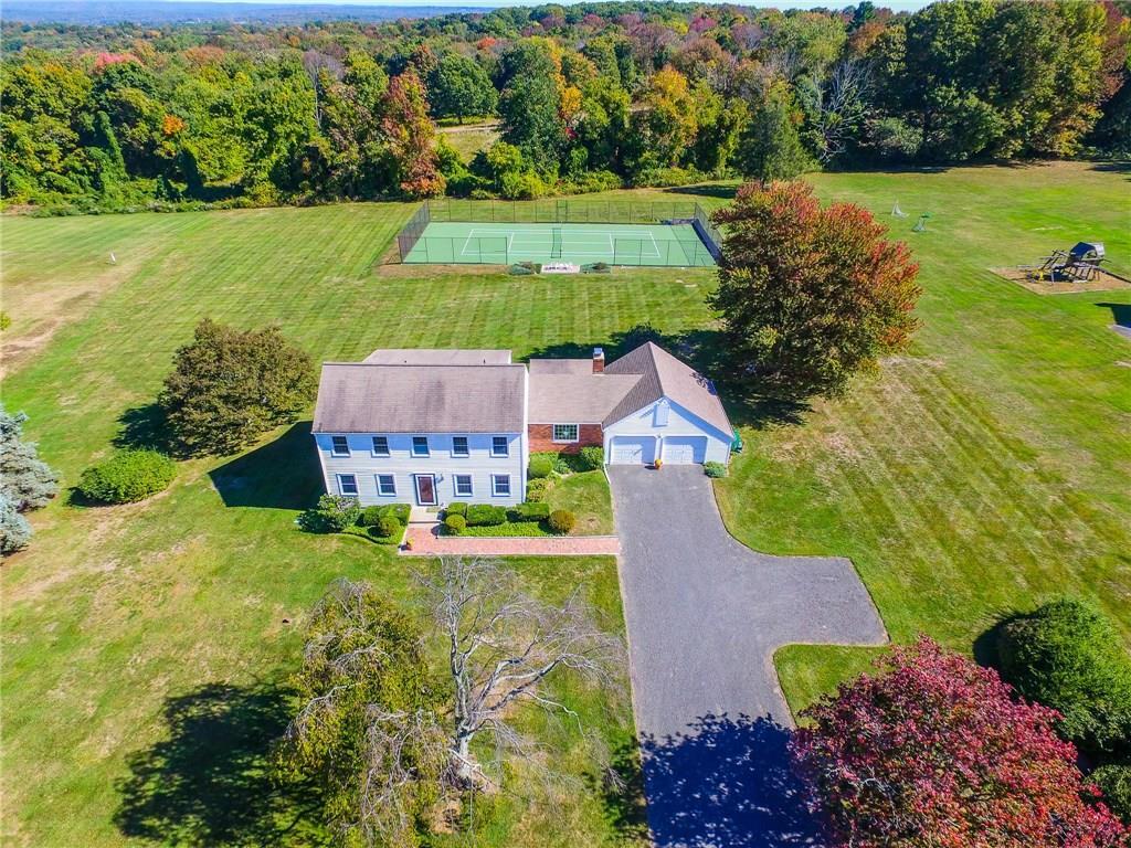 an aerial view of a house with a garden