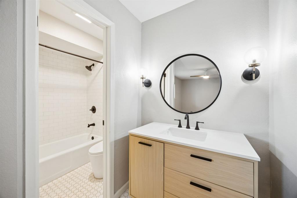 2015 Sandy Trail Richardson, TX 75080 - Photo 12 of 19 a bathroom with a sink a bathtub and a mirror
