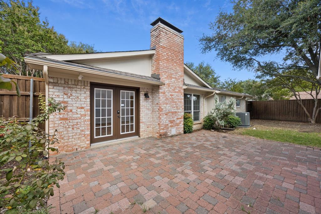 2015 Sandy Trail Richardson, TX 75080 - Photo 18 of 19 a front view of a house with garden