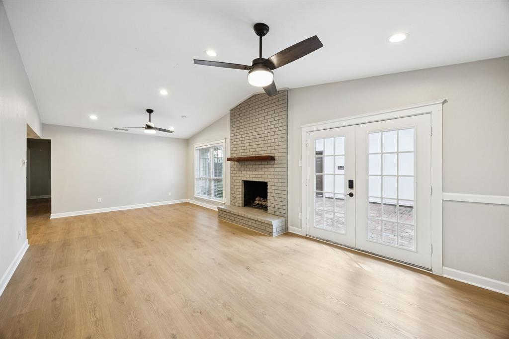 2015 Sandy Trail Richardson, TX 75080 - Photo 6 of 19 an empty room with windows and fireplace