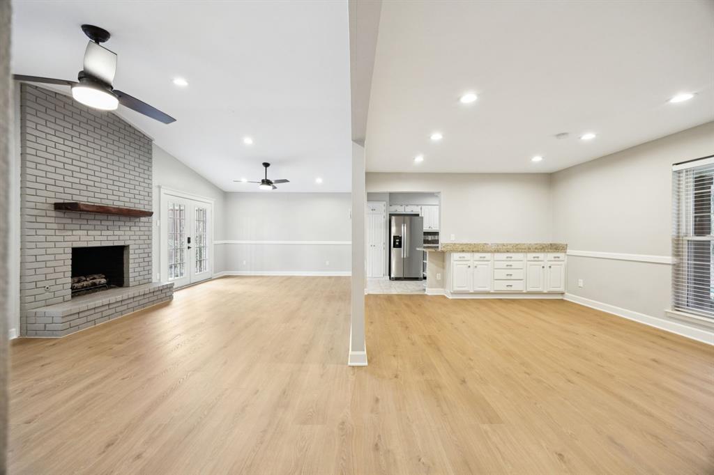 2015 Sandy Trail Richardson, TX 75080 - Photo 8 of 19 a view of empty room with wooden floor and fireplace