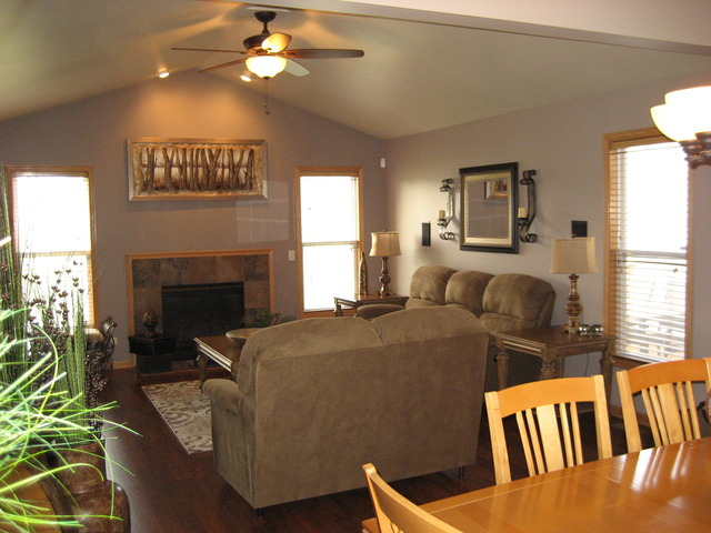 1444 Mackenzie Lane Elgin, IL 60120 - Photo 14 of 25 a living room with furniture a fireplace and a large window