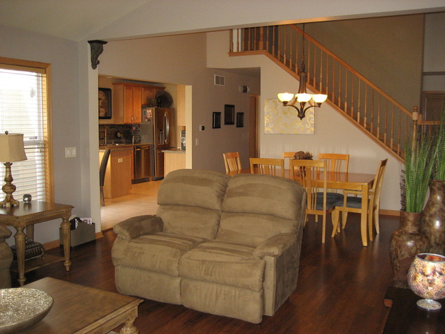 1444 Mackenzie Lane Elgin, IL 60120 - Photo 15 of 25 a living room with furniture and wooden floor