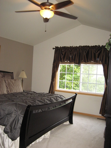 1444 Mackenzie Lane Elgin, IL 60120 - Photo 18 of 25 a bedroom with a bed and a window
