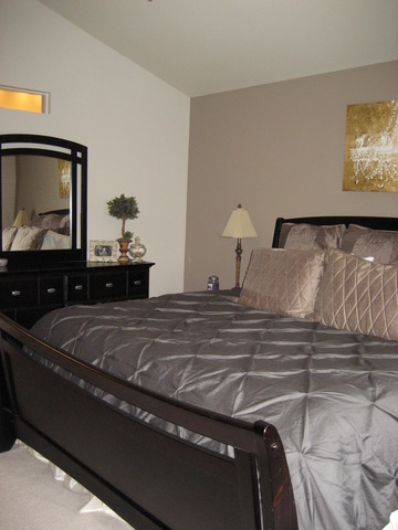 1444 Mackenzie Lane Elgin, IL 60120 - Photo 19 of 25 a bedroom with a bed and painting on the wall