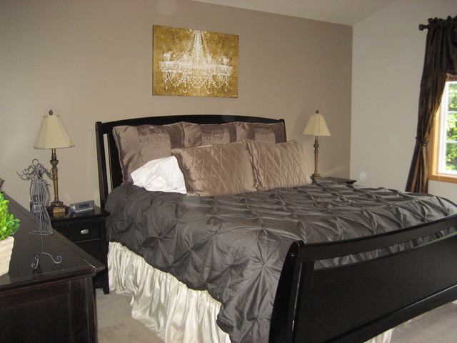 1444 Mackenzie Lane Elgin, IL 60120 - Photo 20 of 25 a bedroom with a bed and a flat tv screen on the dresser