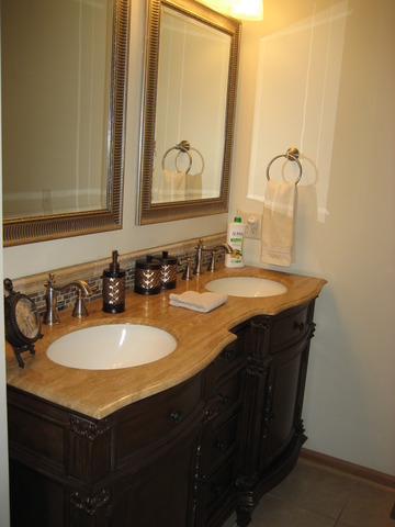 1444 Mackenzie Lane Elgin, IL 60120 - Photo 21 of 25 a bathroom with a sink and a mirror