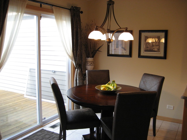 1444 Mackenzie Lane Elgin, IL 60120 - Photo 10 of 25 a dining room with furniture and window