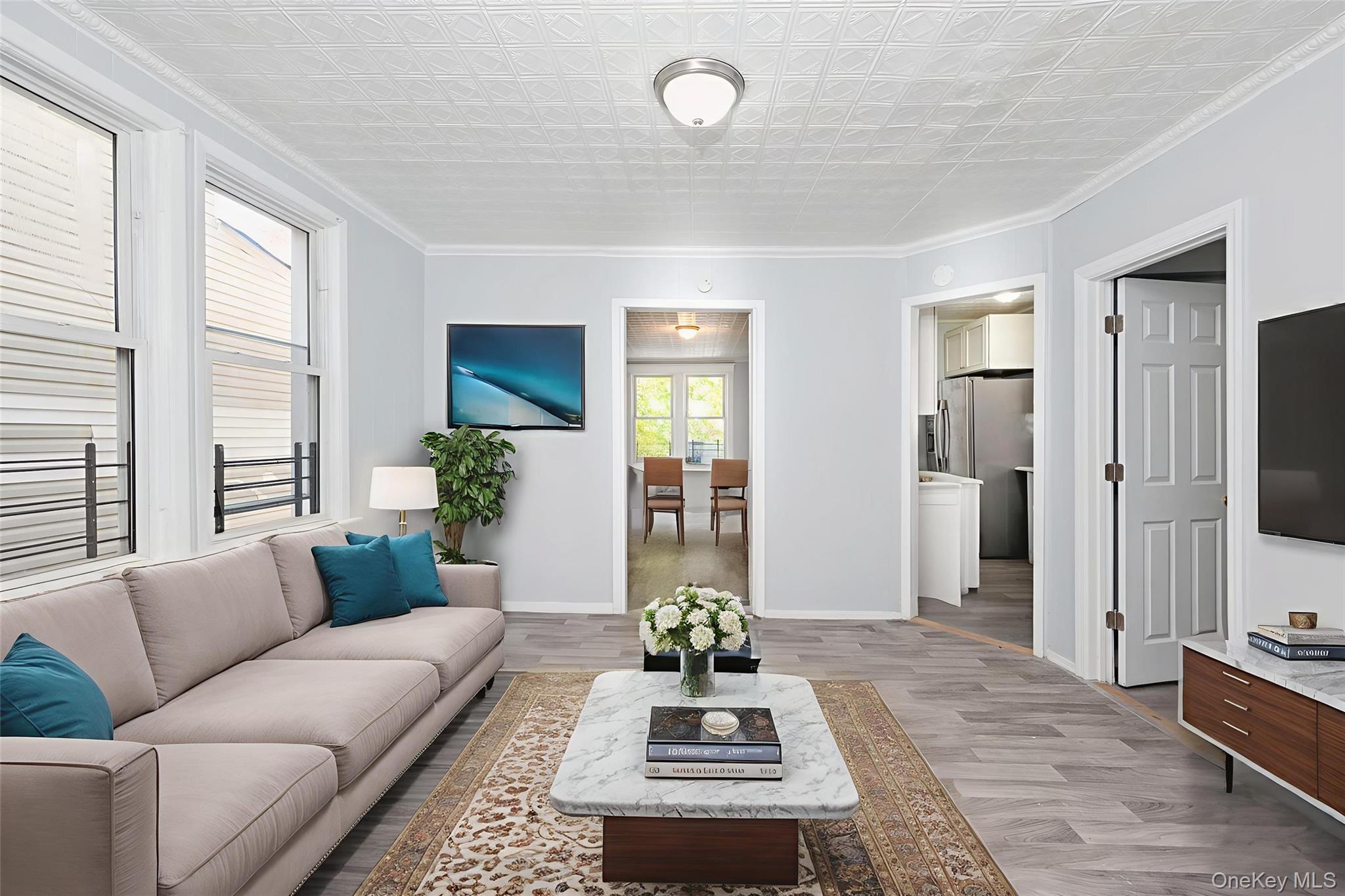 611 St Lawrence Avenue, Unit 1 Bronx, NY 10473 - Photo 1 of 20 a living room with furniture and a flat screen tv