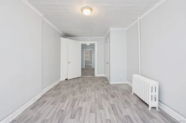 a view of hallway with wooden floor