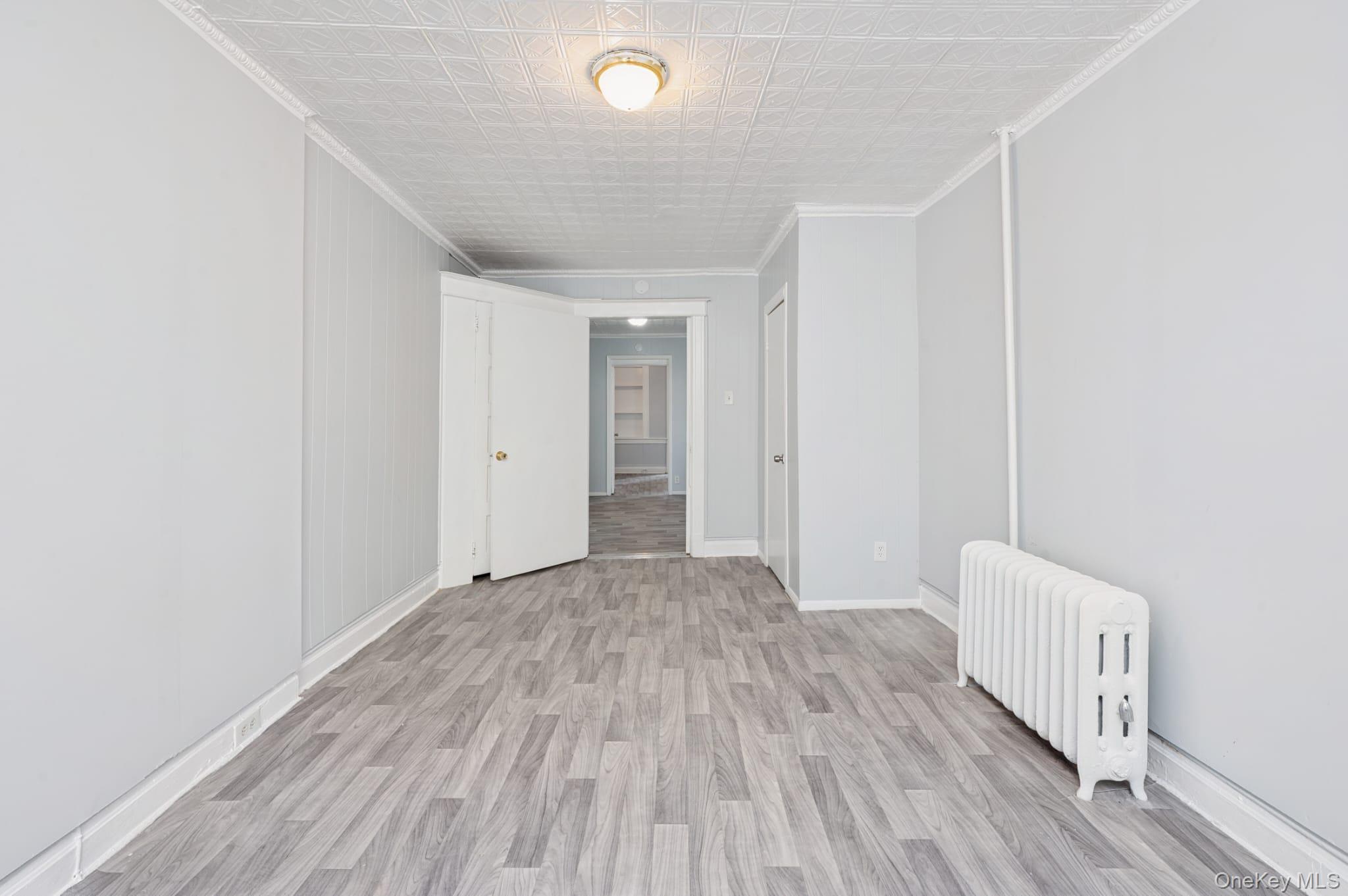 611 St Lawrence Avenue, Unit 1 Bronx, NY 10473 - Photo 15 of 20 a view of hallway with wooden floor