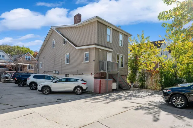 a front view of a house with parking